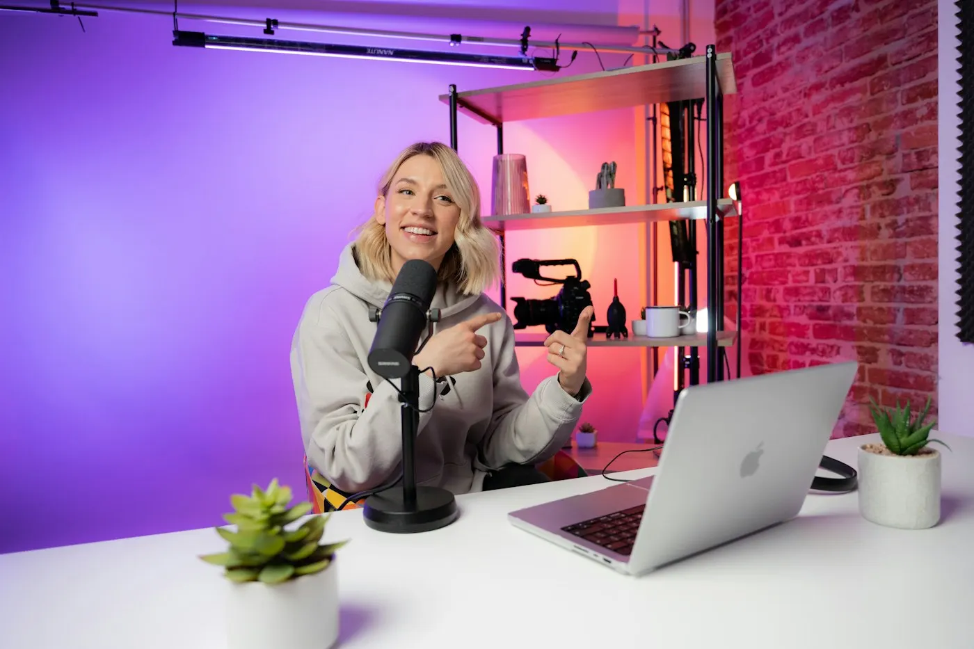 A creator recording a video at a desk