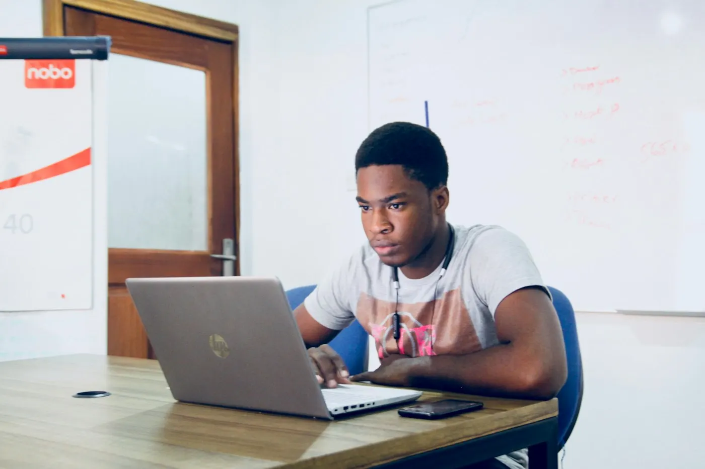 A professional studying at a laptop